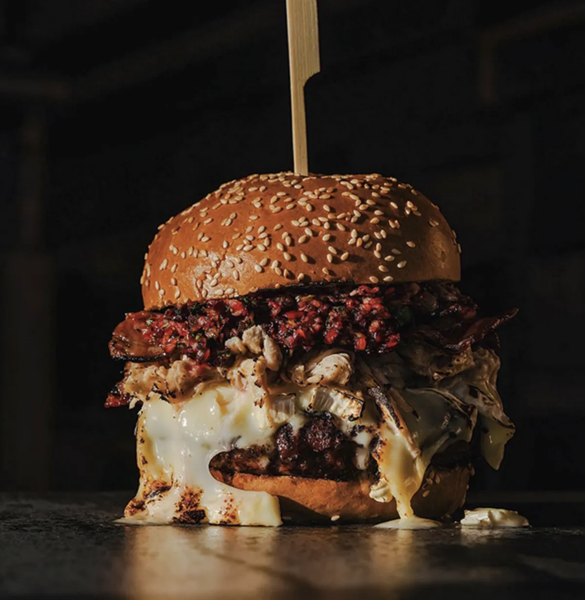 Burger on a dark plate at Rumpus Burger Saltaire